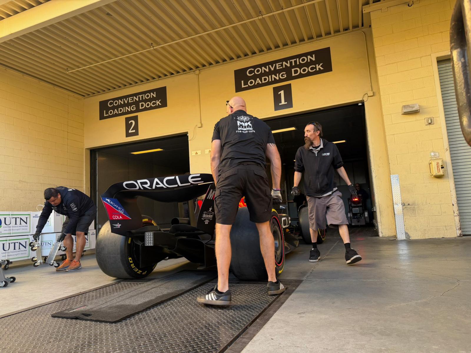 MK Trader crew loading F1 car at convention dock