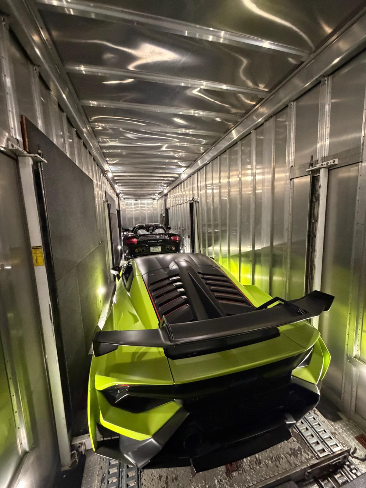 Lamborghini SCV12 in enclosed trailer