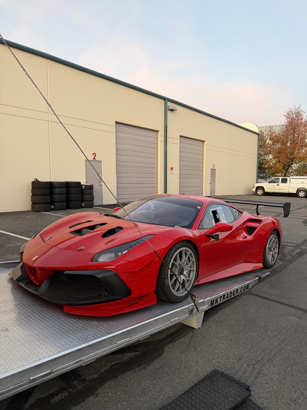 Ferrari 488 GT race car on transport