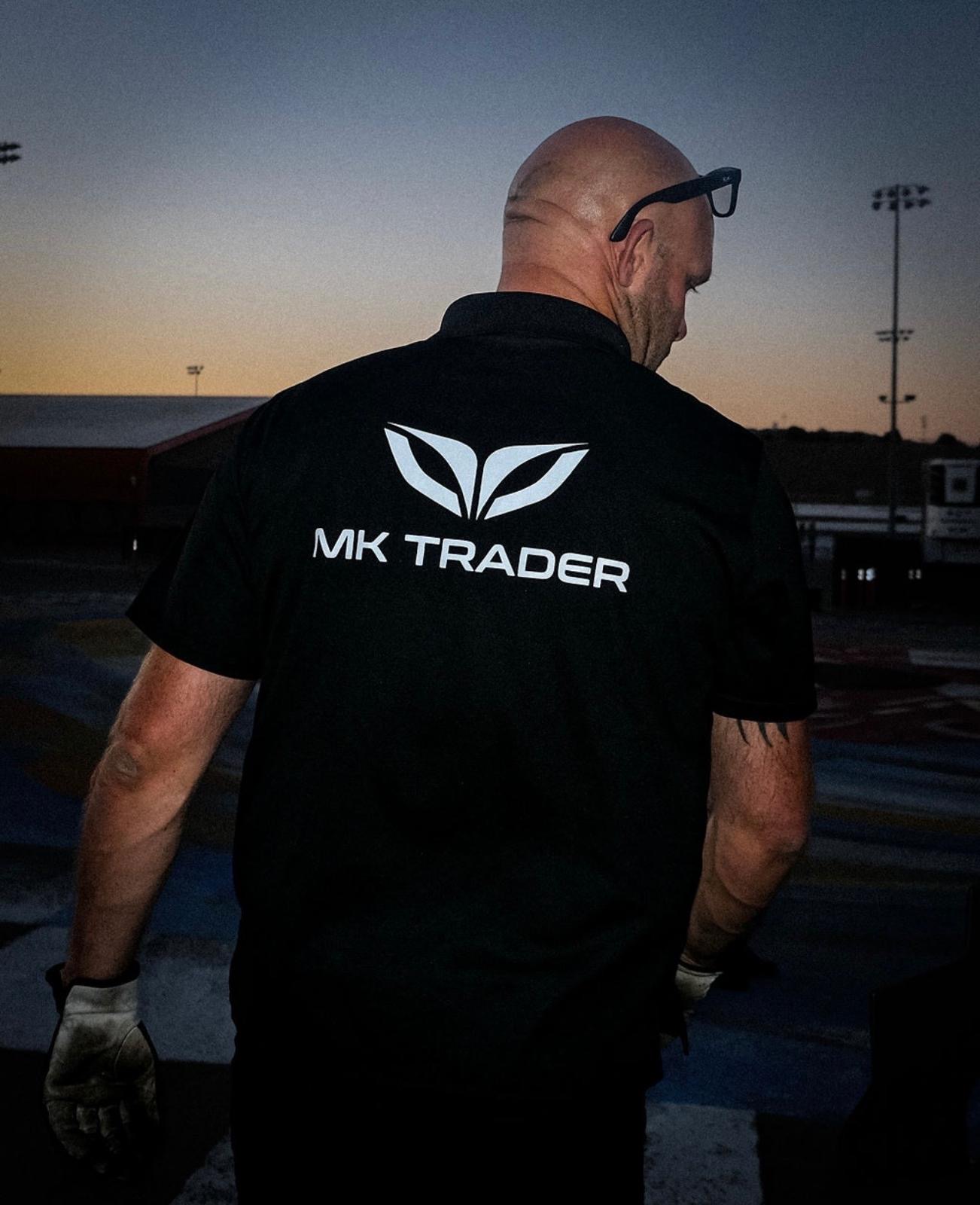 Magnus Karlsson in MK Trader polo at dusk